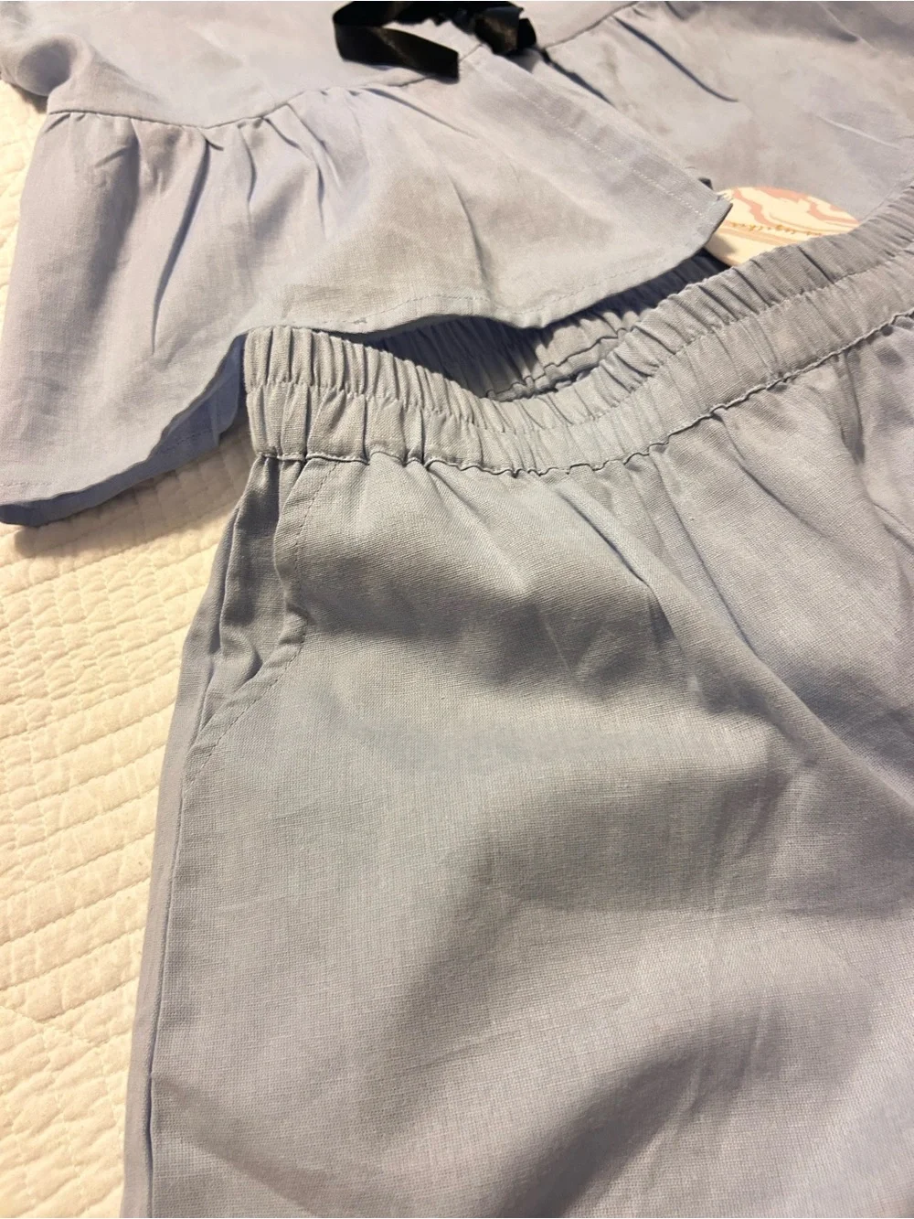 Shorts and blouse light blue set .